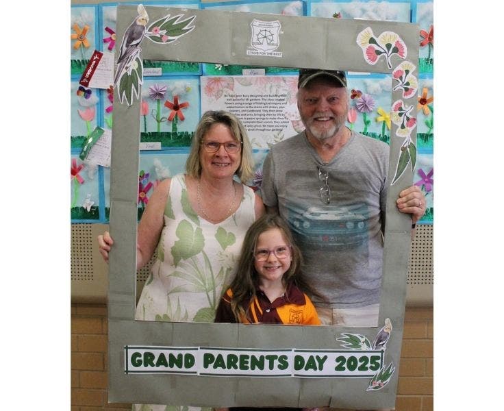 Grandparents with grand daughter for grandparents day