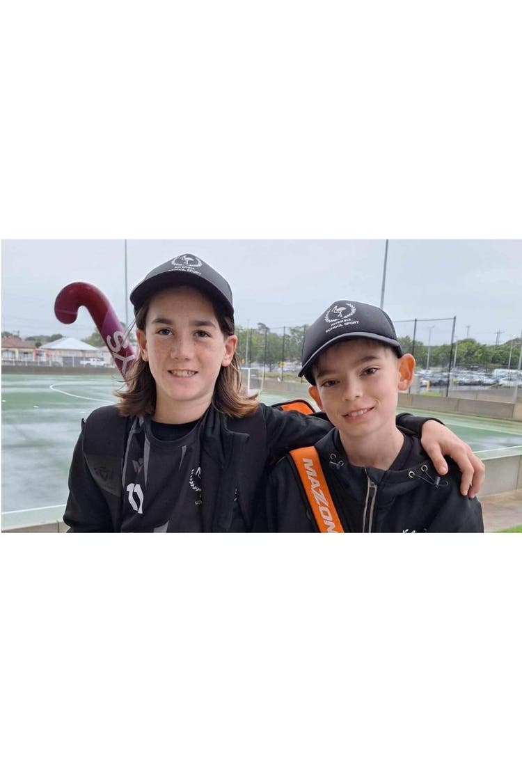 2 boys representing the school in hockey