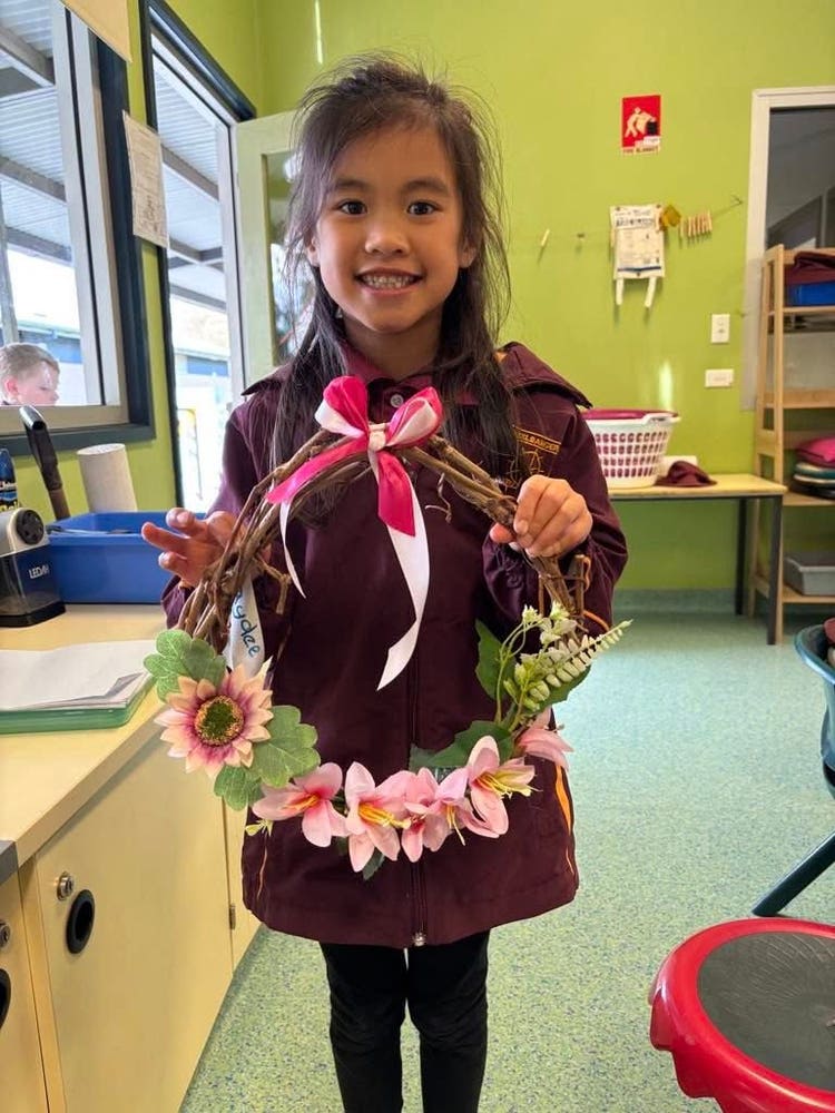 Student with grapevine wreath made during lunch time